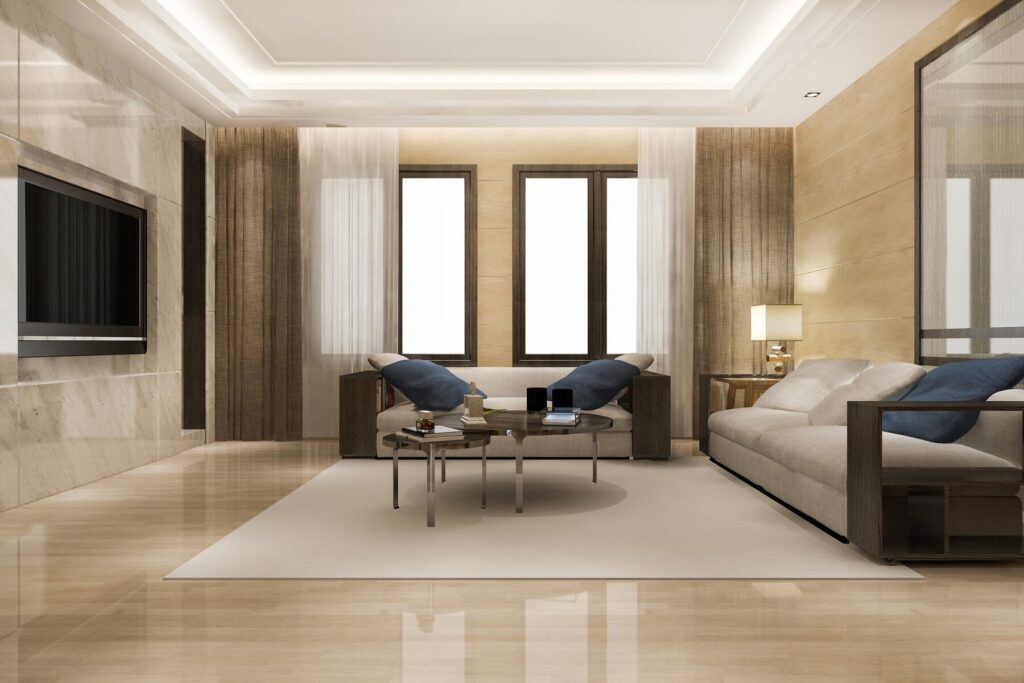 Modern living room featuring a stylish sofa, glass coffee table, and large windows with sheer curtains, illuminated by soft lighting.