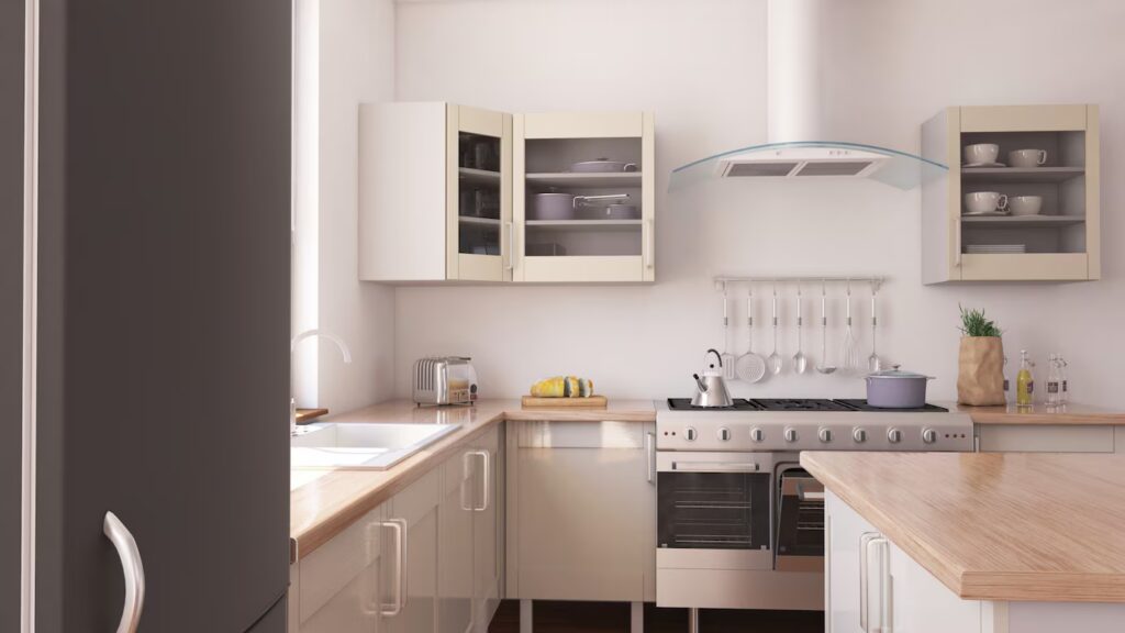 Modern kitchen with white cabinets, wooden countertops, a stainless steel stove, and pots displayed above a neat countertop.